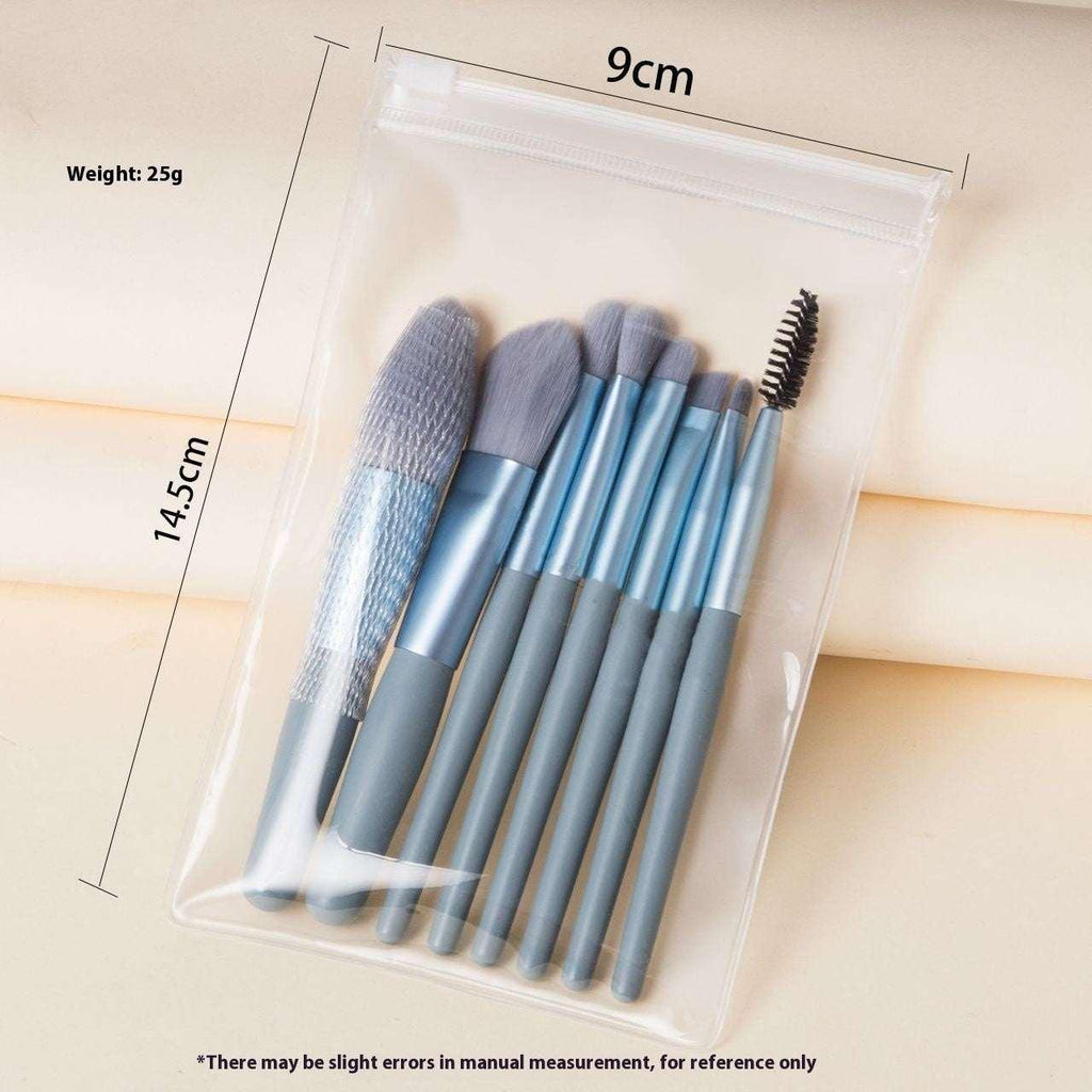 Set of blue makeup brushes with spoolie in clear pouch, 14.5cm x 9cm, 25g.