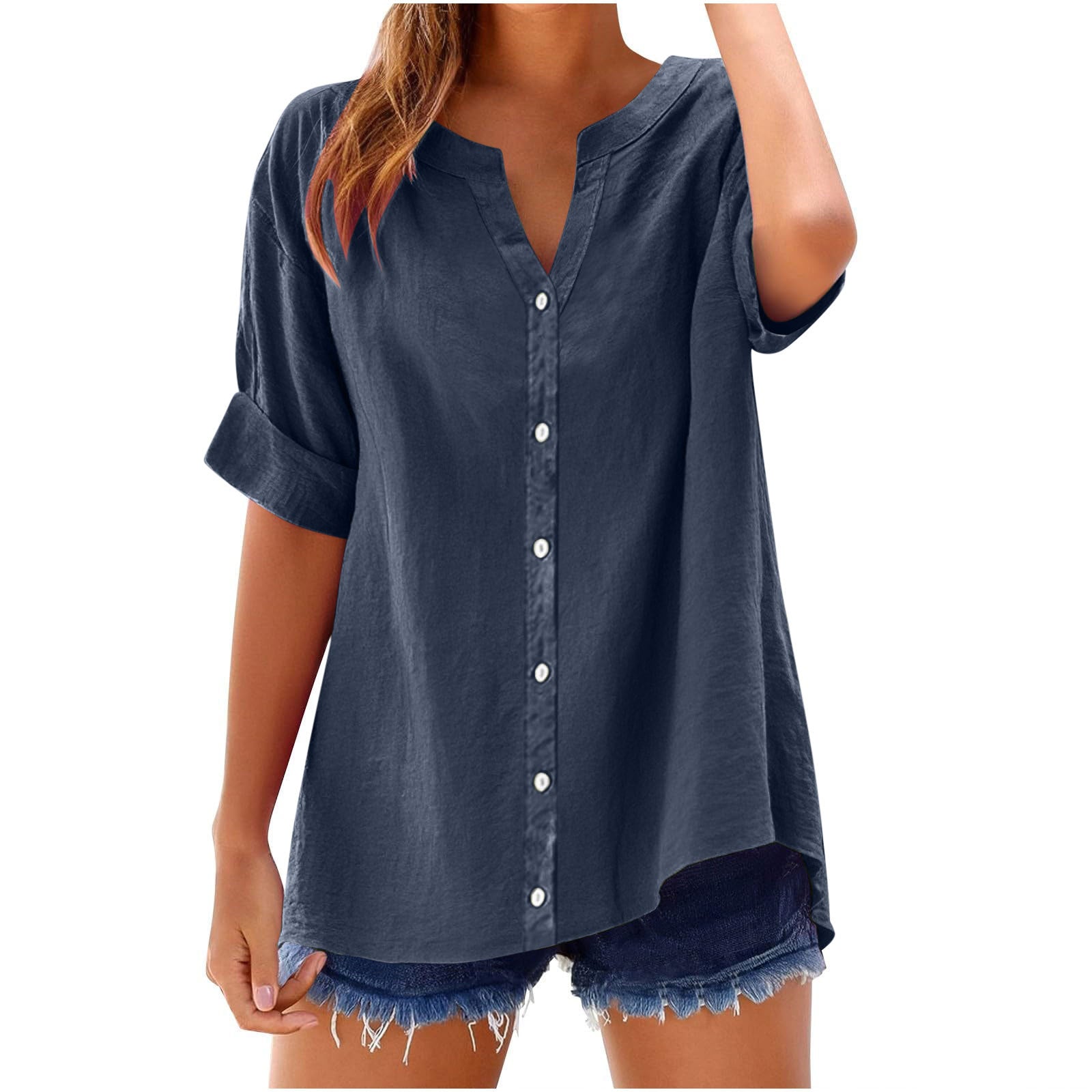 Navy blue button-up shirt worn by a person on a white background