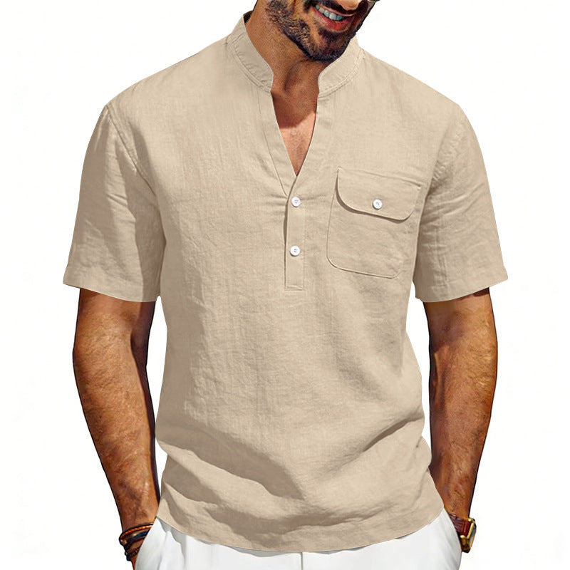 Man wearing a beige short-sleeve shirt with a pocket on a white background