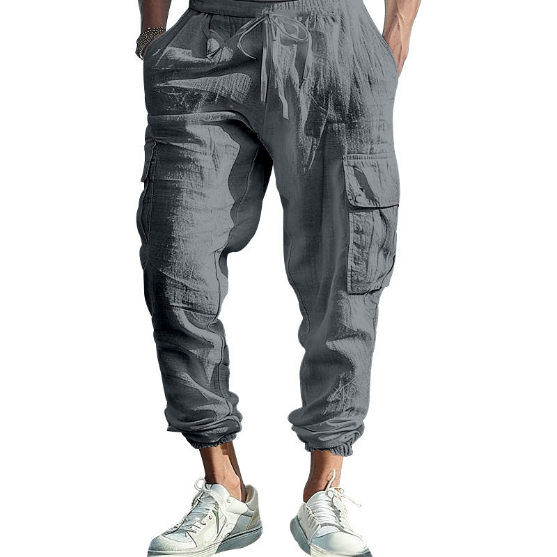 Gray cargo jogger pants worn by a person on a white background