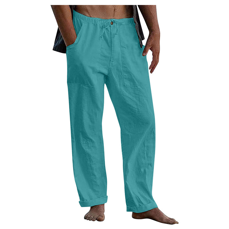 Teal pants worn by a person on a white background
