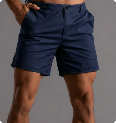 Navy blue shorts worn by a person on a gray background