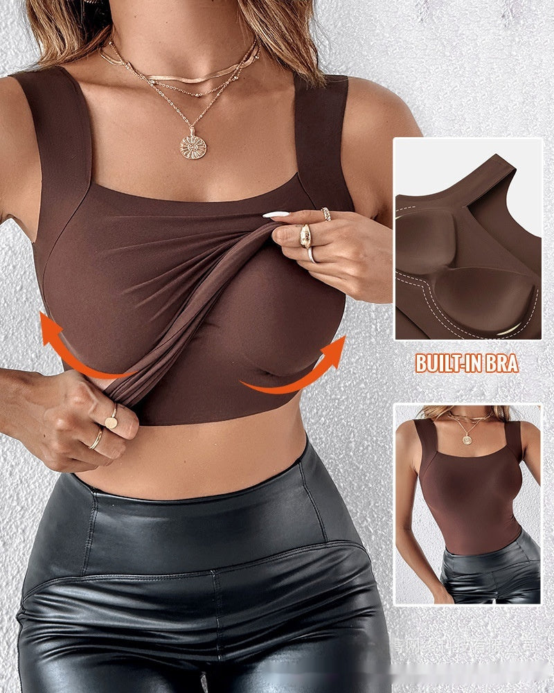 Woman wearing a brown sports bra with built-in bra feature, on a gray background.