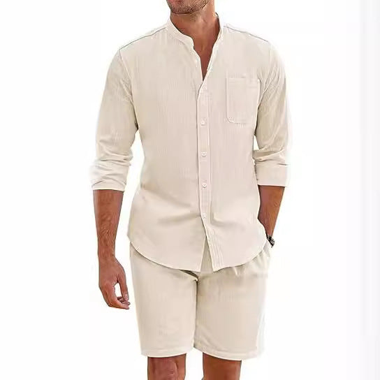 Man wearing a beige shirt and shorts set on a white background