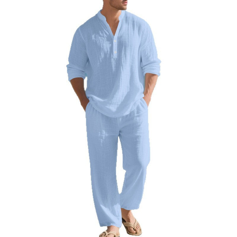 Man wearing a light blue linen shirt and pants on a white background