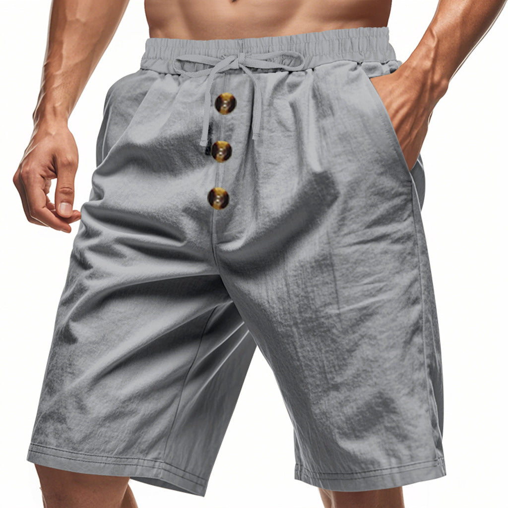 Gray shorts with button details on a white background