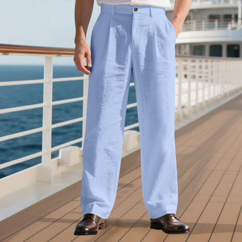 Person wearing light blue pants standing on a cruise ship deck with ocean view