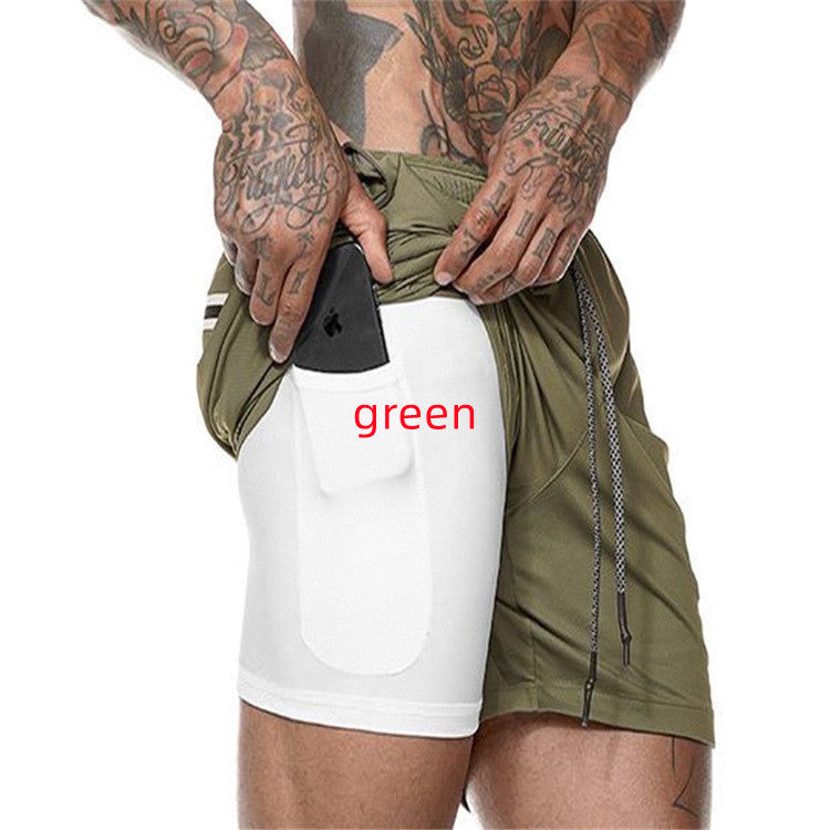 Person wearing green shorts with a white patch displaying the word 'green'.