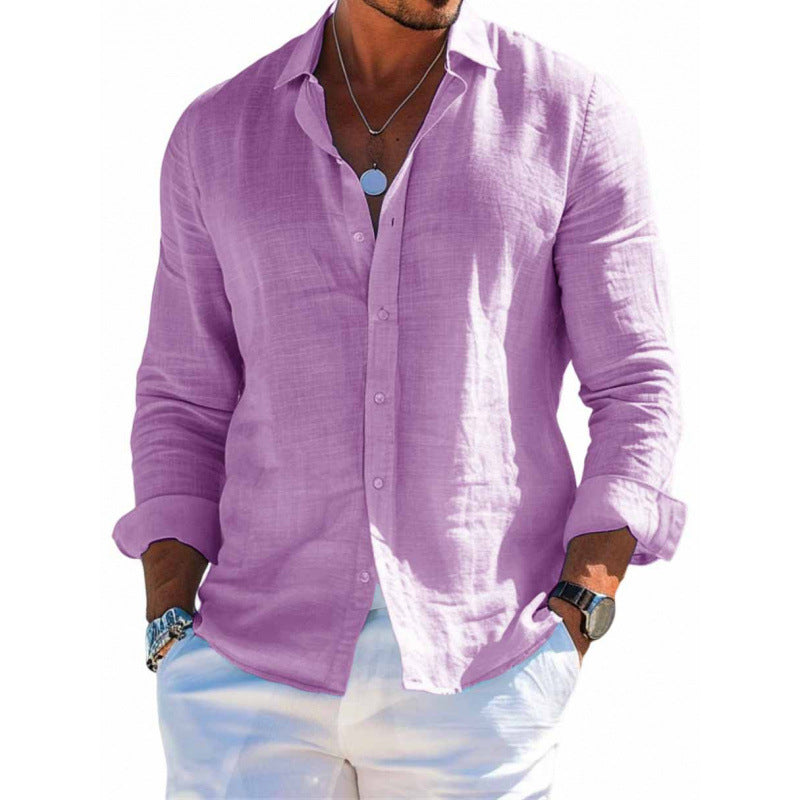 Man wearing a purple button-up shirt and white pants on a white background