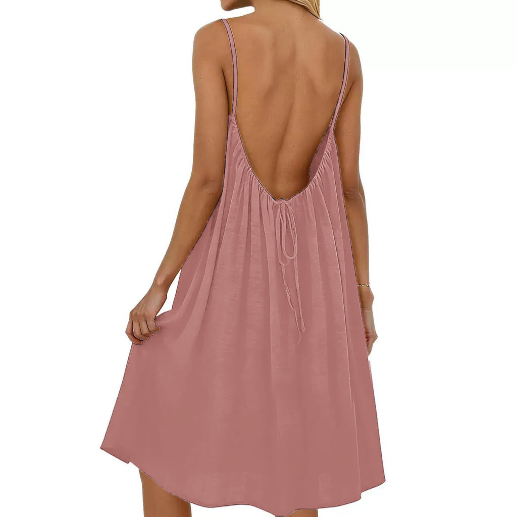 Pink dress with open back on a white background