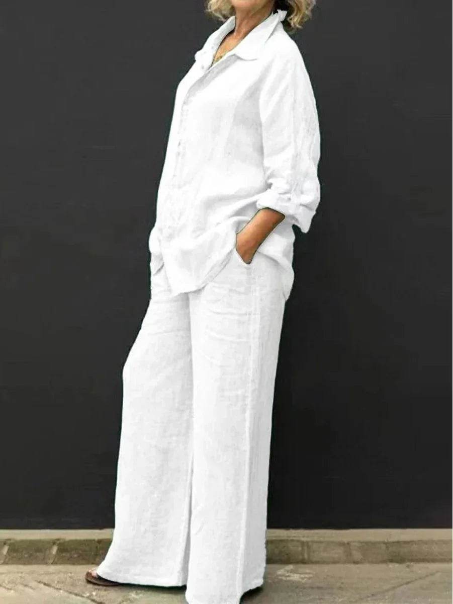 Woman wearing a loose white linen shirt and wide-leg pants, ZA-Zola fashion style