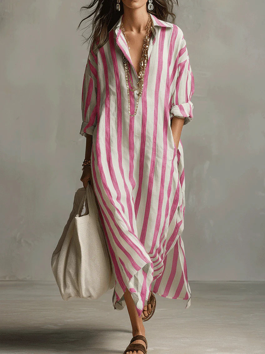 Woman wearing a pink and white striped dress with a plain background