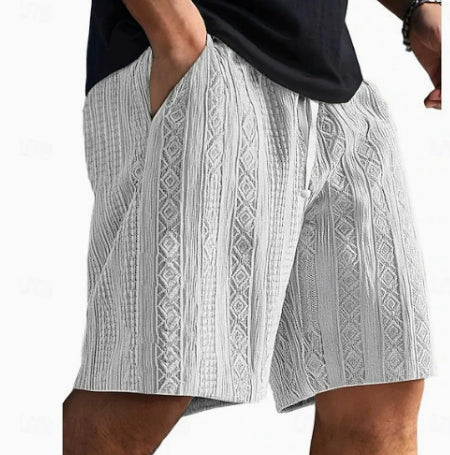 White patterned shorts worn by a person on a white background