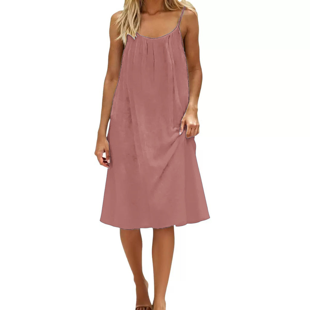 Woman wearing a pink slip dress on a white background