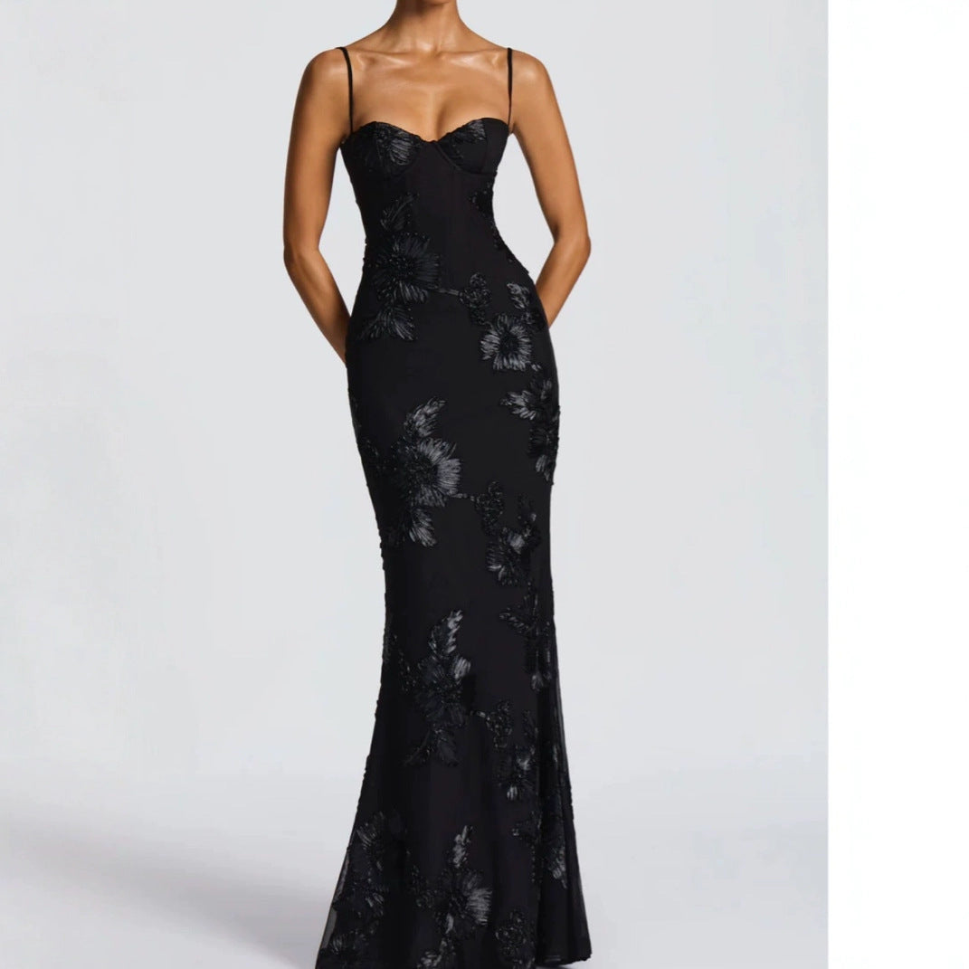 Black lace evening gown on a white background