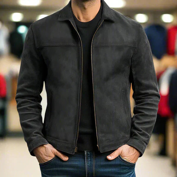 Person wearing a black jacket in an indoor setting