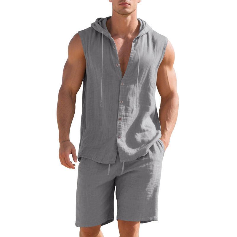 Man wearing a gray sleeveless hoodie and shorts on a white background