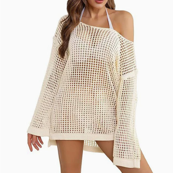 Beige crochet cover-up dress worn by a model on a white background