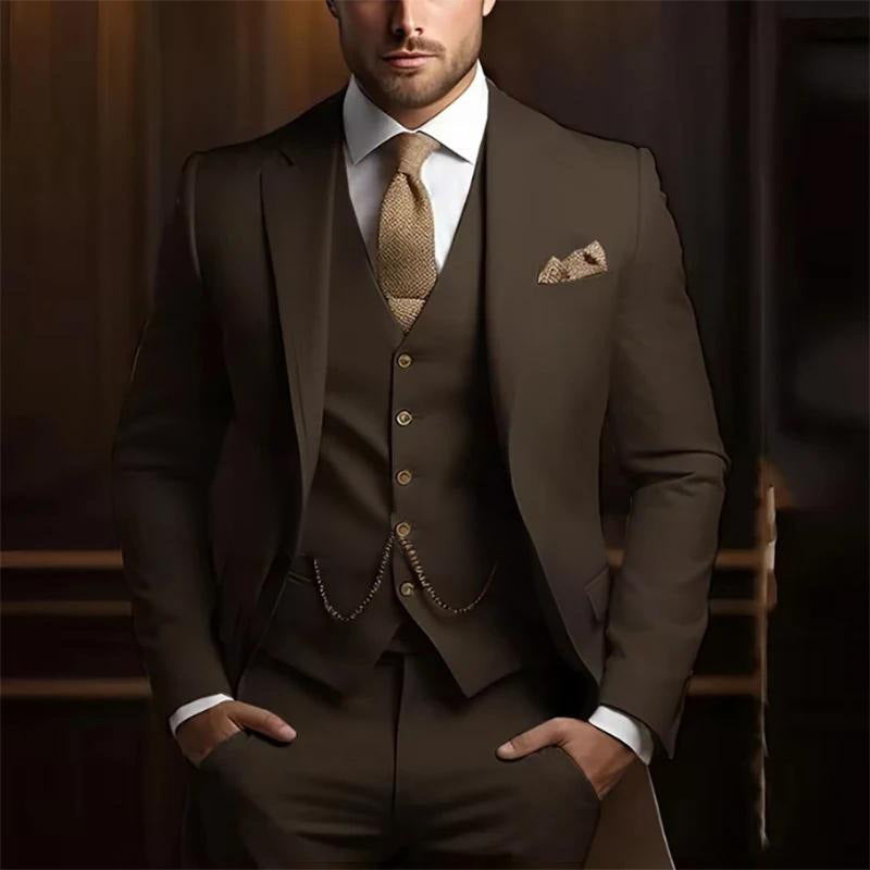 Man wearing a brown suit with a patterned tie and pocket square against a dark background