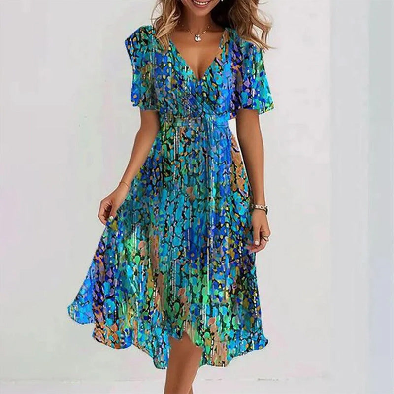 Woman wearing a blue and green patterned dress on a white background