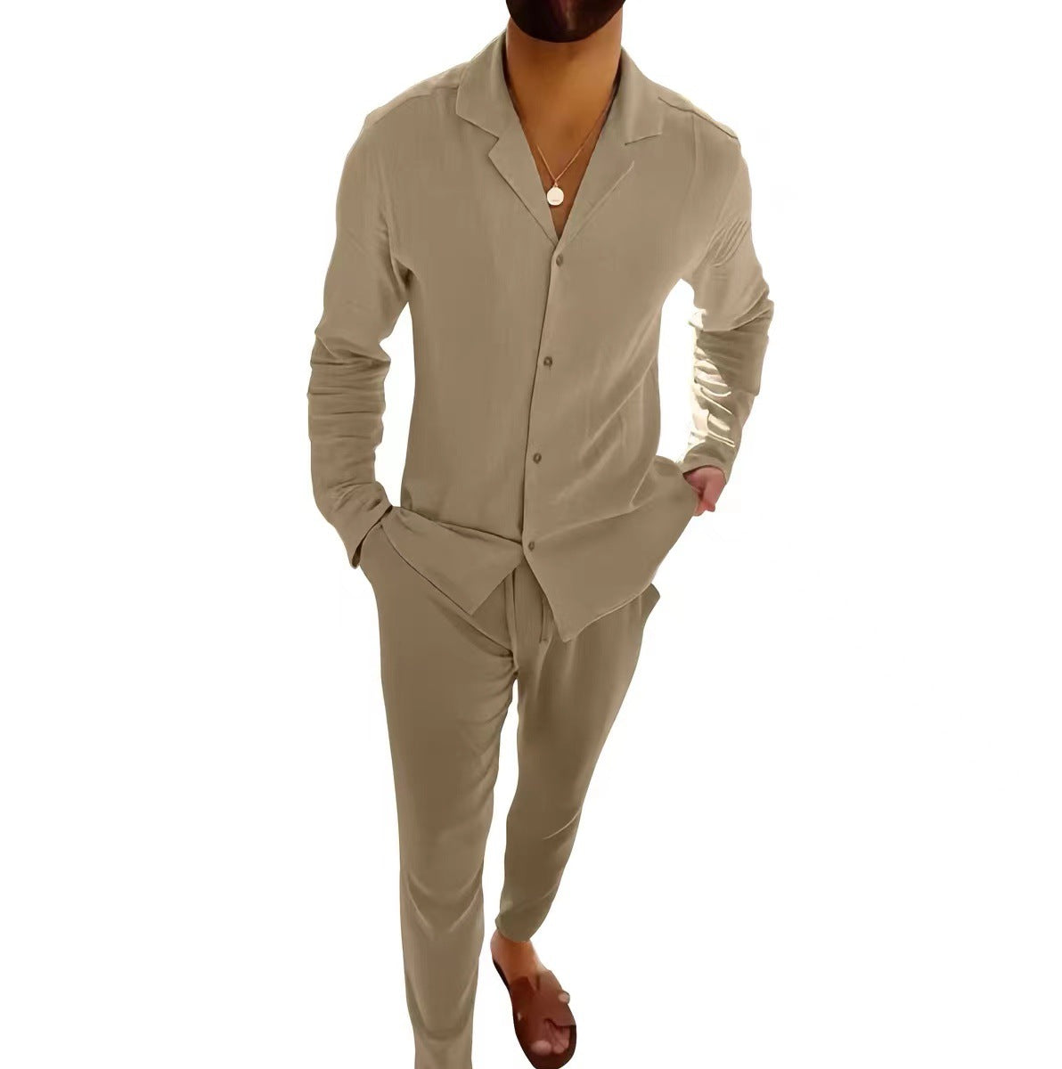 Man wearing a beige suit on a white background