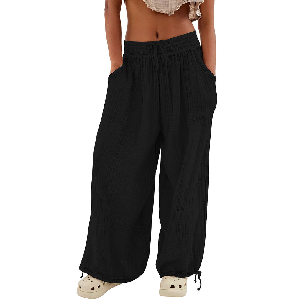 Navy blue wide-leg pants worn by a person on a white background