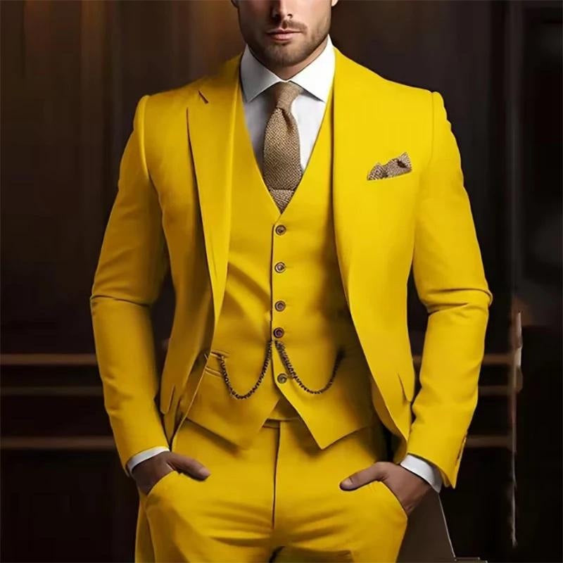 Man wearing a bright yellow suit with a patterned tie and pocket square against a dark background
