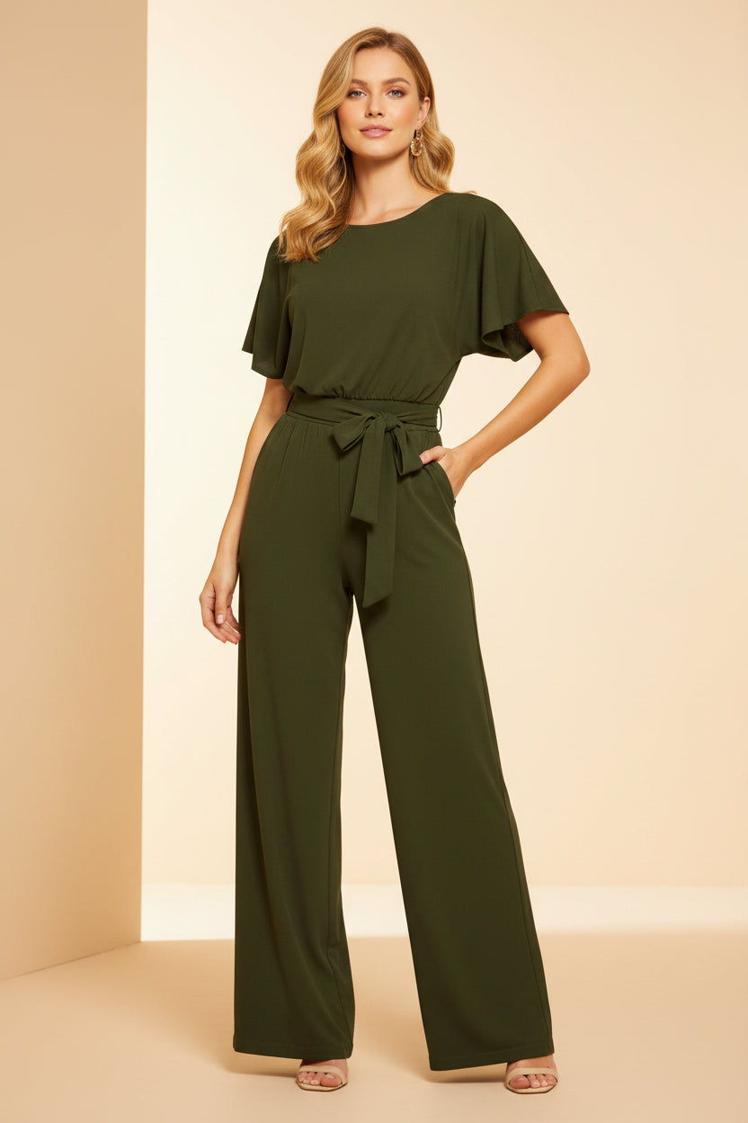 Green jumpsuit worn by a model on a white background