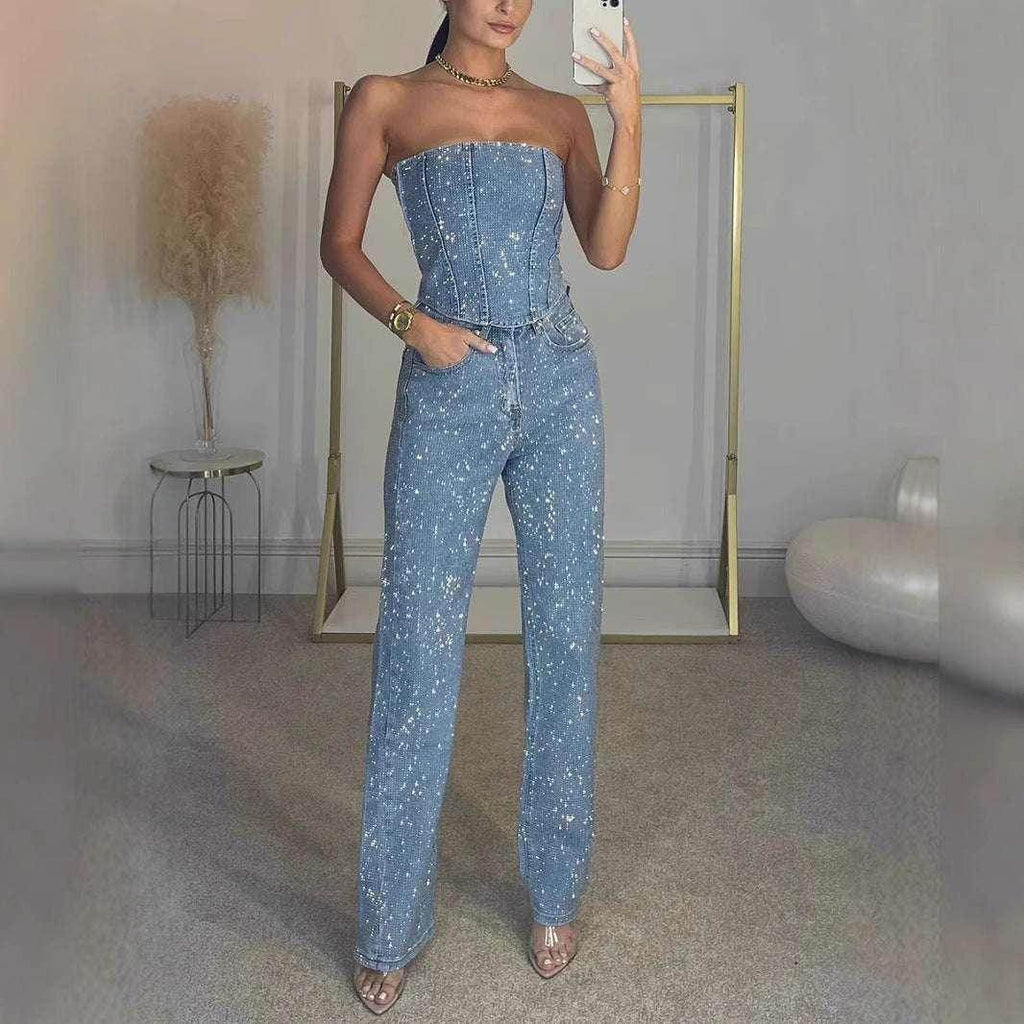 Woman in blue strapless denim jumpsuit with white speckles, stylish ZA-Zola fashion.