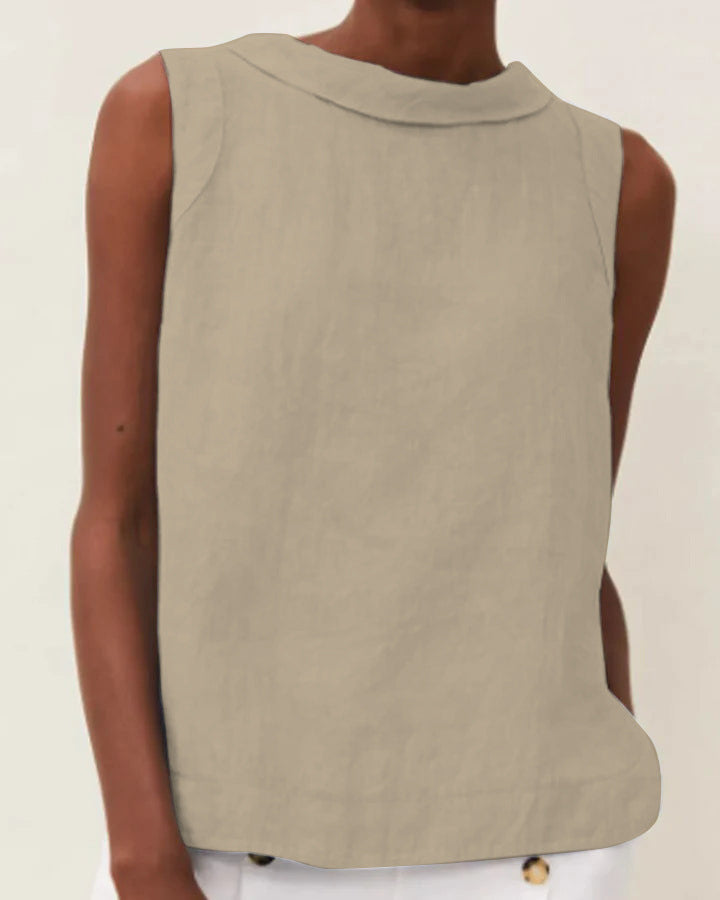Beige sleeveless top worn by a person on a plain background