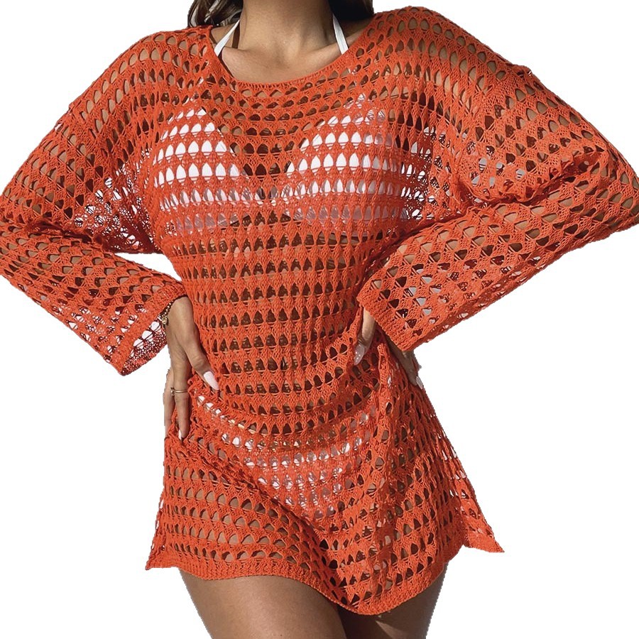Orange crochet dress on a white background