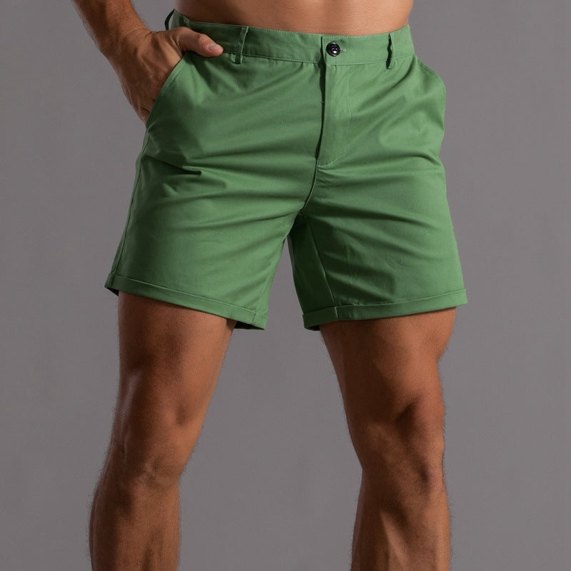 Green shorts worn by a person on a gray background