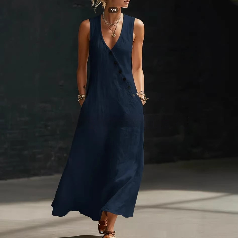 Woman wearing a navy blue dress against a dark background