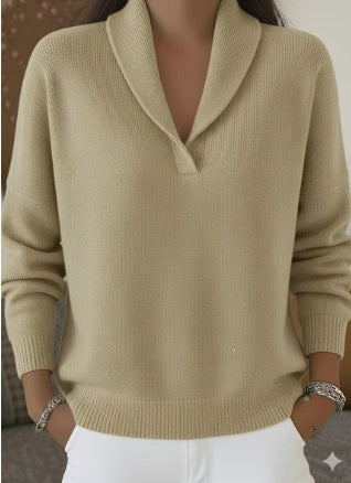 Beige sweater worn by a person with a neutral background