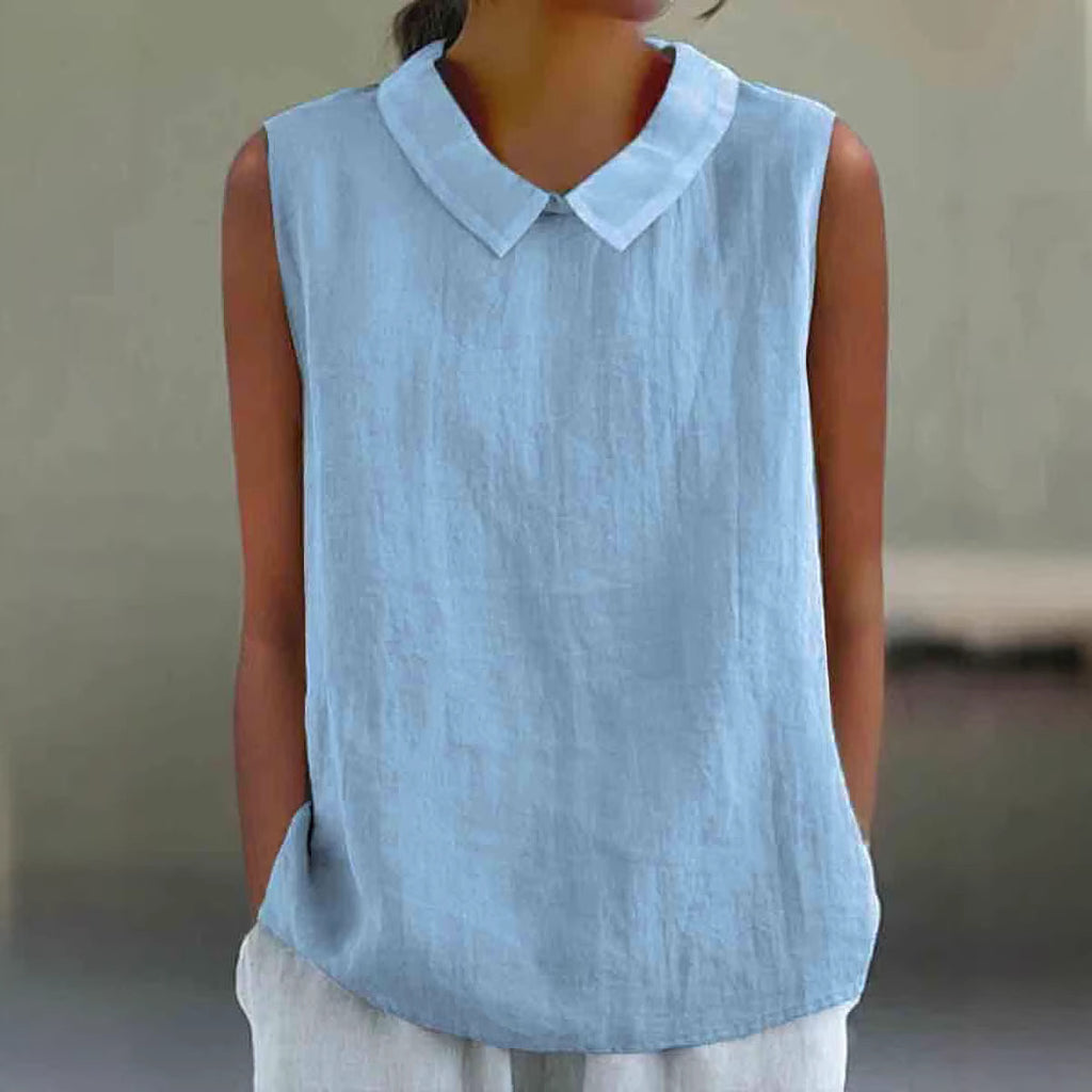 Light blue sleeveless top with a collar worn by a person against a neutral background