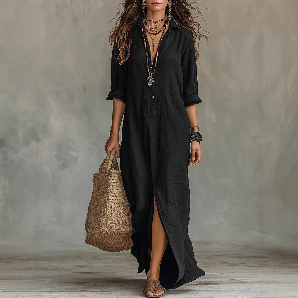 Woman wearing a black dress holding a woven bag against a neutral background