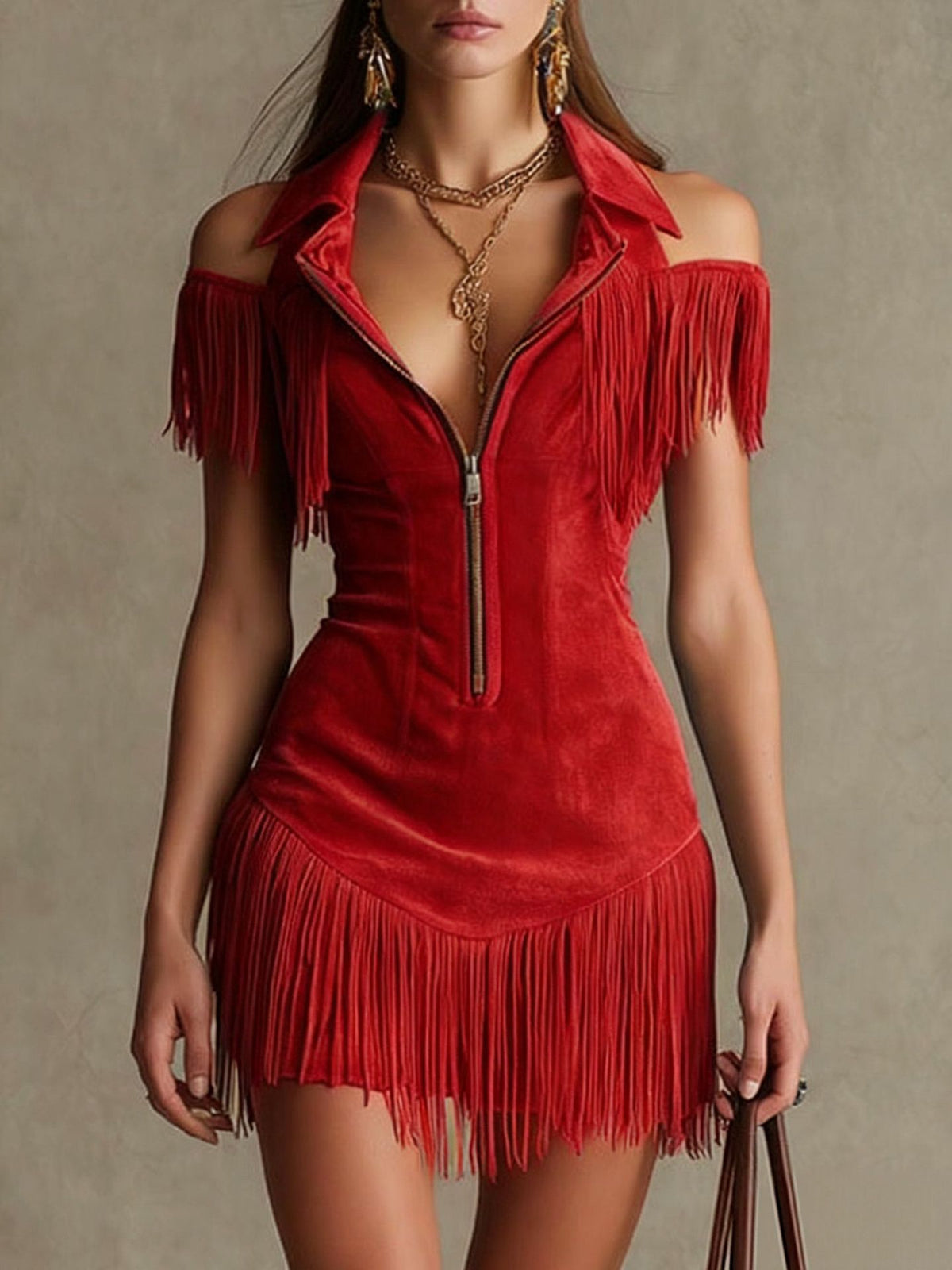 Red fringed dress with gold zipper on a neutral background