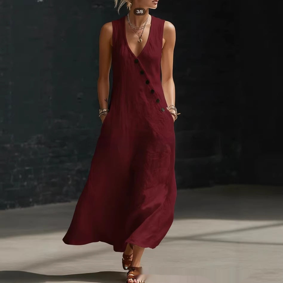 Woman wearing a burgundy dress with black buttons against a dark background