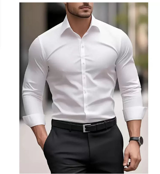 Man wearing a white dress shirt and black pants with a blurred background