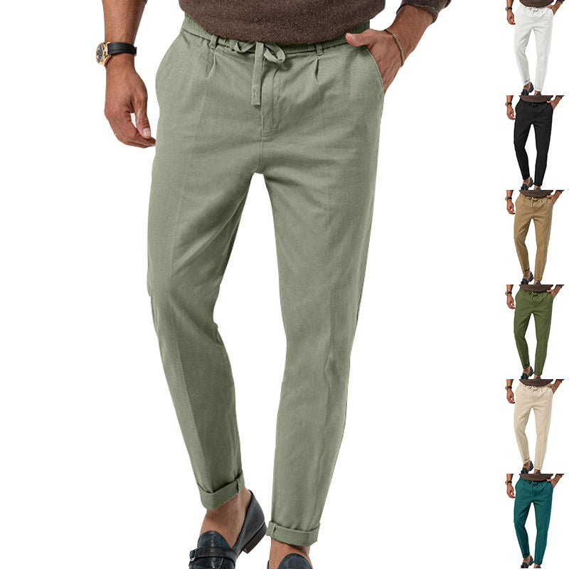 Green pants worn by a person on a white background with multiple color options displayed.