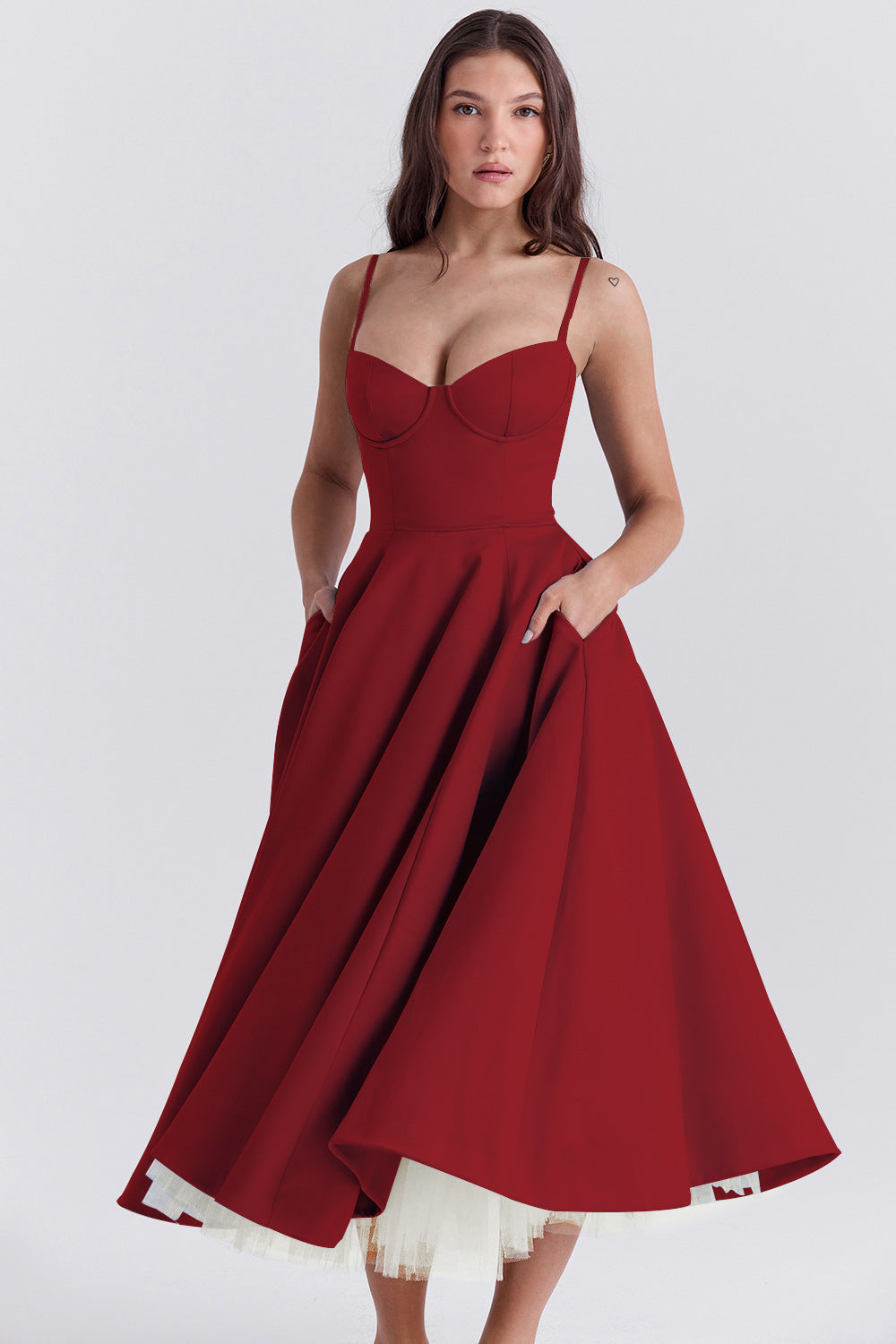 Red dress with a white hem on a plain background