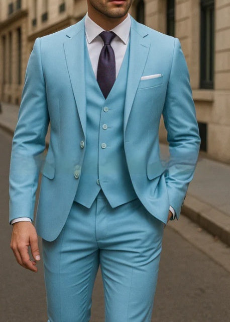 Man wearing a light blue suit with a purple tie in an urban setting