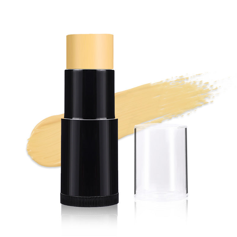 Makeup stick with beige shade and black casing on a white background