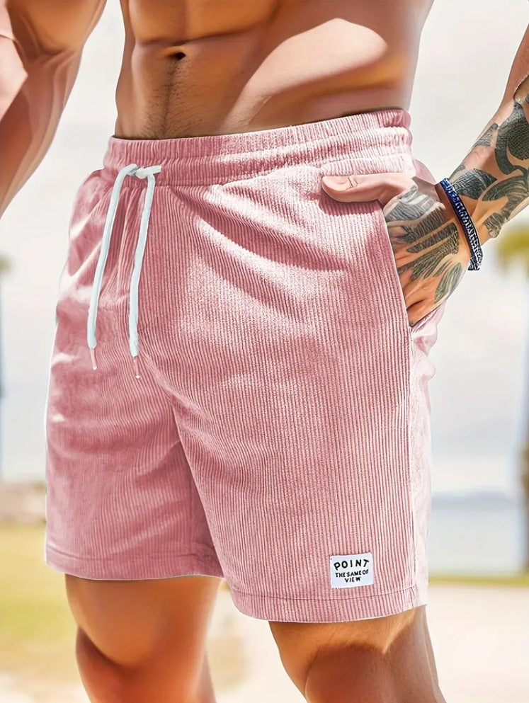 Person wearing pink shorts with a blurred background