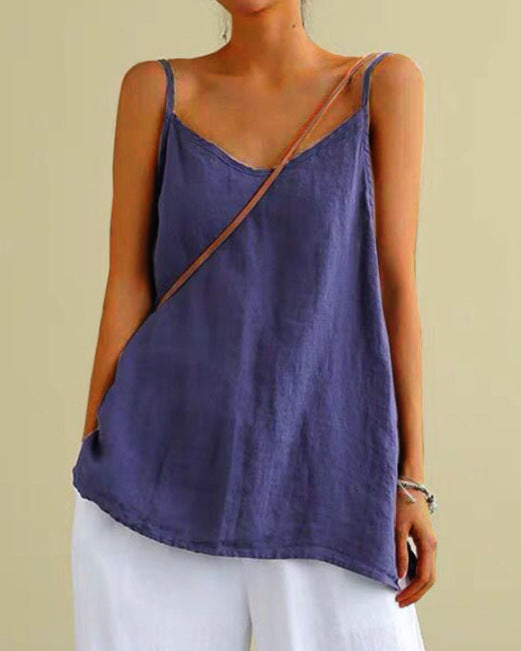 Person wearing a purple tank top with a beige background