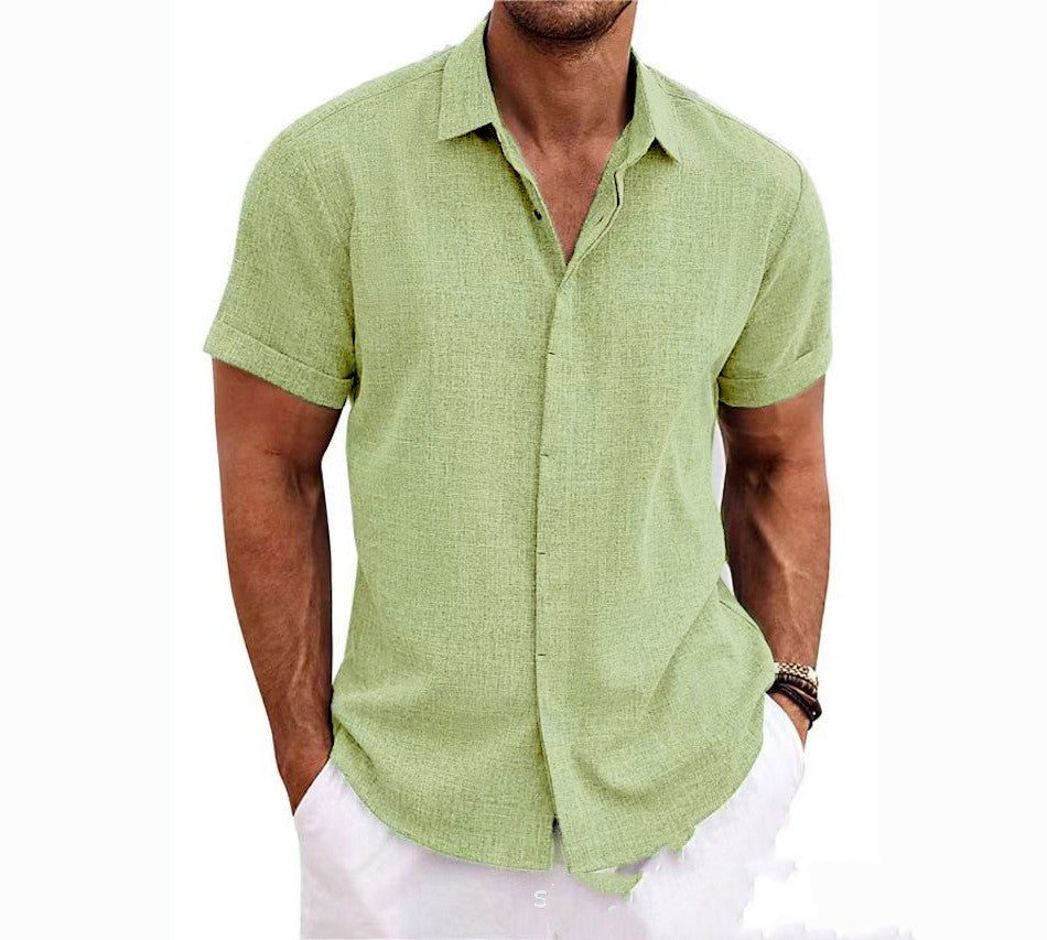Man wearing a green short-sleeve shirt on a white background