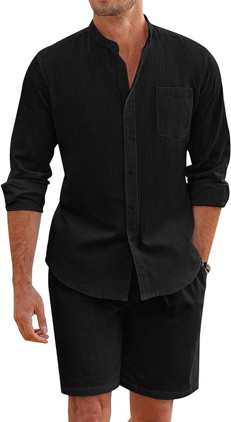 Man wearing a black long-sleeve shirt and black shorts on a white background