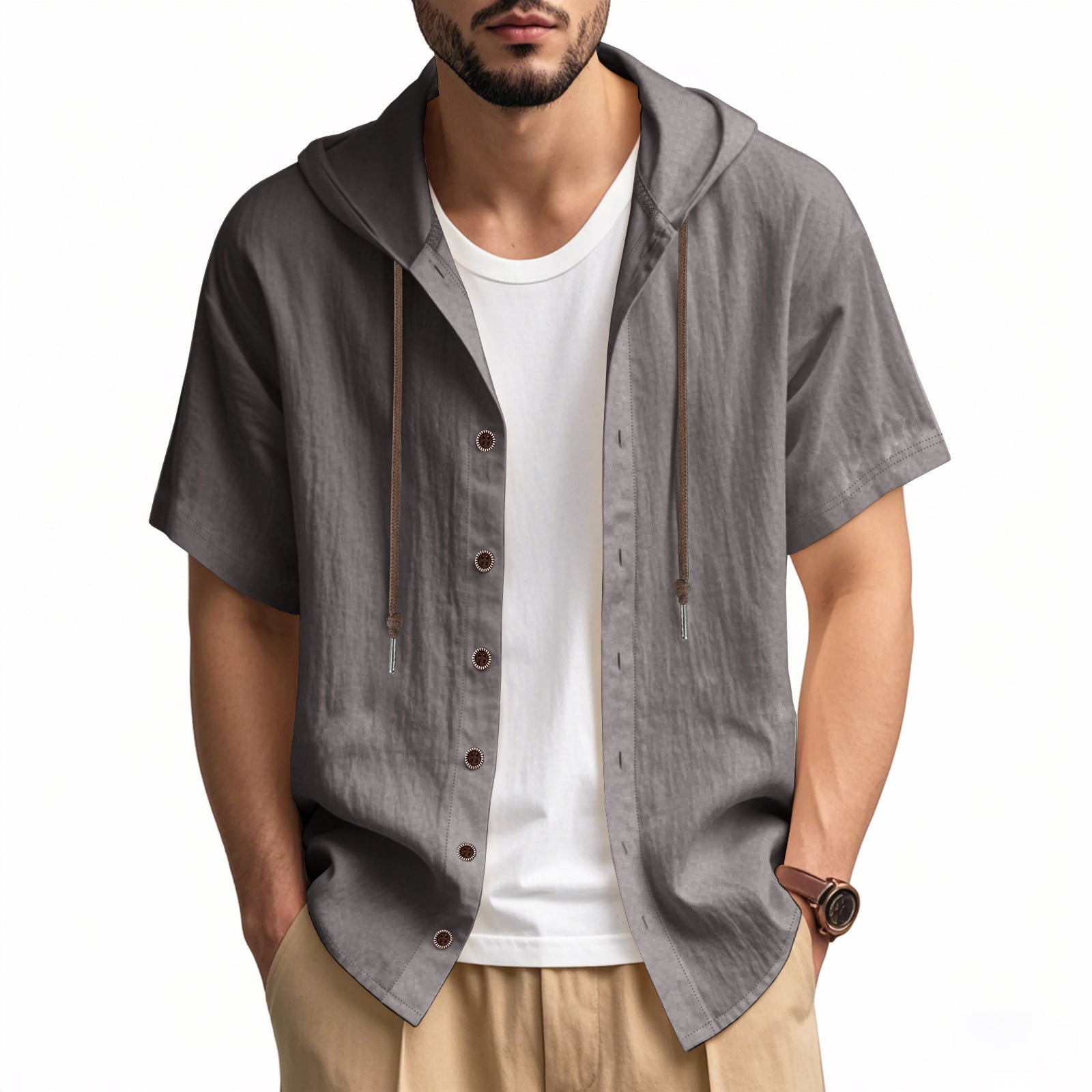 Man wearing a gray short-sleeve hooded shirt over a white t-shirt on a white background