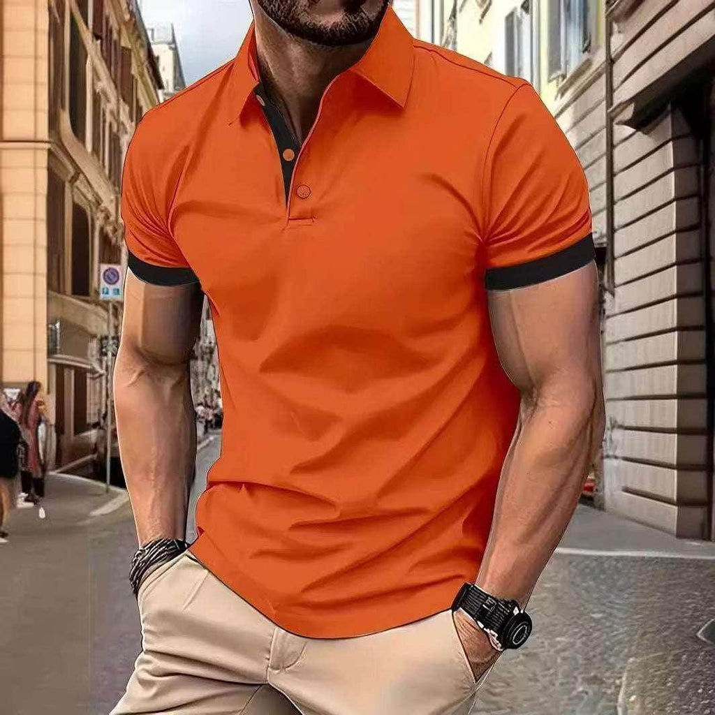 Man in urban street wearing bright orange short-sleeve polo shirt, beige pants, ZA-Zola fashion.