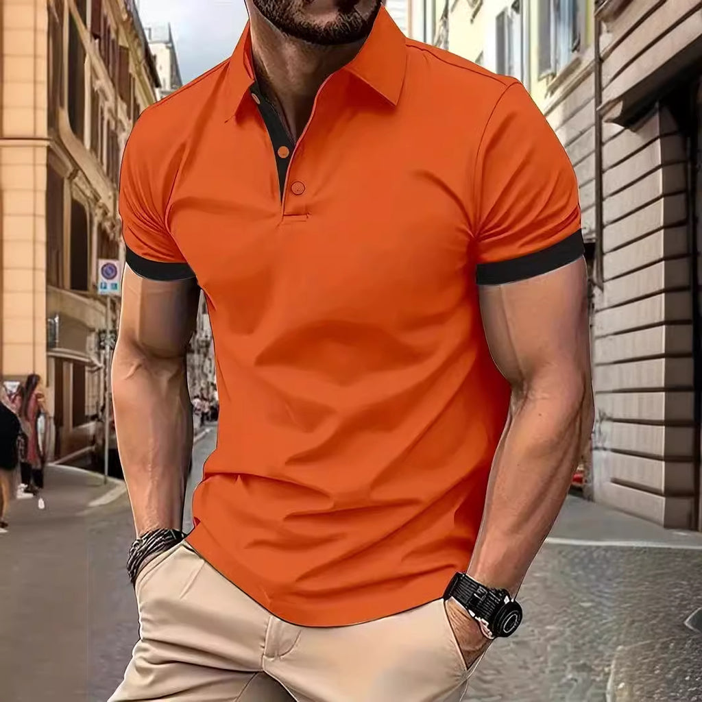 Man wearing an orange polo shirt with black trim on a city street.